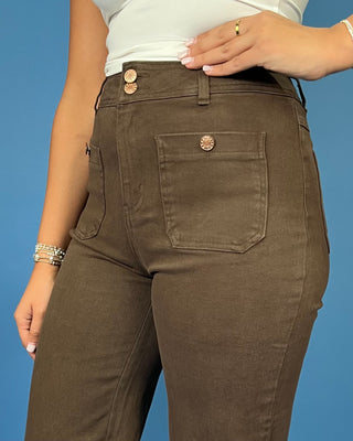 Chocolate brown high-rise wide leg pants with gold button details, front patch pockets, and a flattering cropped silhouette.