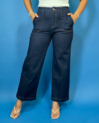 Dark wash high-rise wide leg jeans with front patch pockets, flattering seam details, and a cropped ankle-length silhouette.