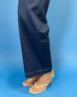 Dark wash high-rise wide leg jeans with front patch pockets, flattering seam details, and a cropped ankle-length silhouette.