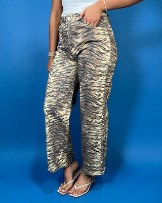 Tan and black tiger print high-rise wide leg jeans with a bold allover animal print and flattering cropped length.