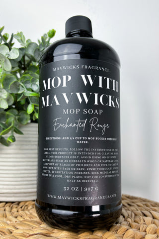 Mawwicks Mop Soap bottle on a woven surface with a plant in the background