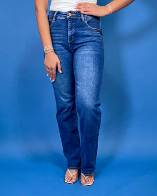 Medium-to-dark wash high-rise straight leg jeans with subtle fading, a clean finish, classic five-pocket styling, and a full-length silhouette.