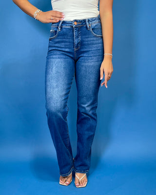 Medium-to-dark wash high-rise straight leg jeans with subtle fading, a clean finish, classic five-pocket styling, and a full-length silhouette.