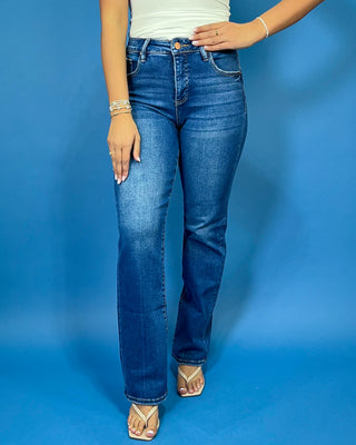 Medium-to-dark wash high-rise straight leg jeans with subtle fading, a clean finish, classic five-pocket styling, and a full-length silhouette.