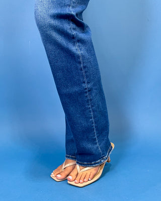 Medium-to-dark wash high-rise straight leg jeans with subtle fading, a clean finish, classic five-pocket styling, and a full-length silhouette.
