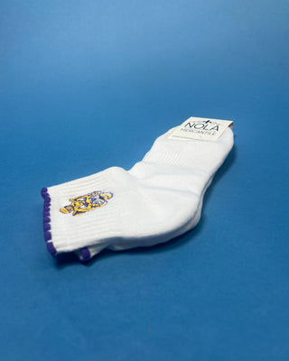 White LSU ankle socks with purple scalloped trim and an embroidered LSU Tiger logo, featuring a soft knit fabric and ribbed cuff for comfortable everyday wear.