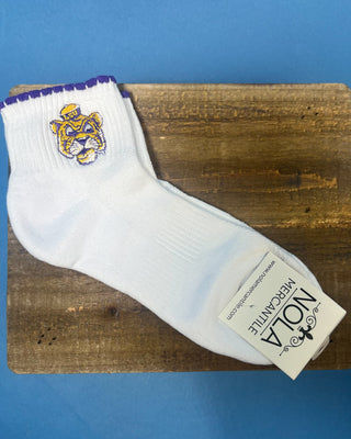 White LSU ankle socks with purple scalloped trim and an embroidered LSU Tiger logo, featuring a soft knit fabric and ribbed cuff for comfortable everyday wear.