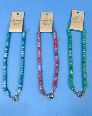 Three beaded gemstone necklaces displayed side-by-side