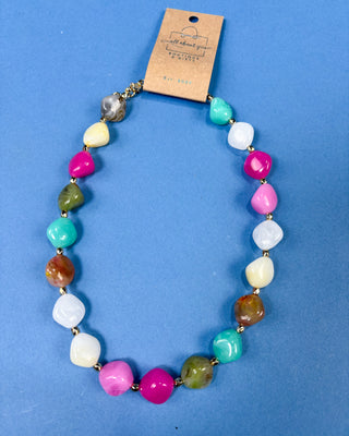 Multi-color chunky marbled plastic beaded necklace with gold-tone spacer beads and an adjustable chain for women.