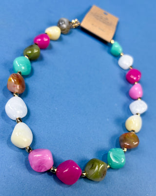 Multi-color chunky marbled plastic beaded necklace with gold-tone spacer beads and an adjustable chain for women.