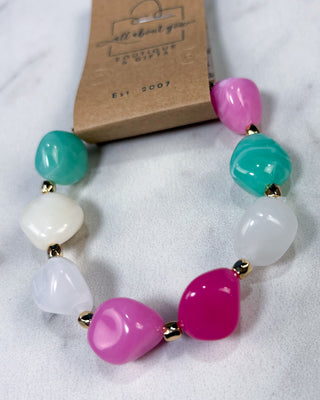 Pastel chunky marbled plastic beaded stretch bracelet with gold-tone spacer beads for women.