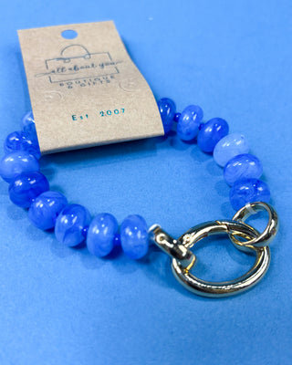 A beaded bracelet with glossy blue beads