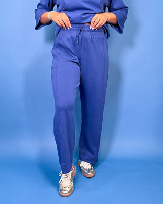 a matching royal blue lounge set consisting of a short-sleeve top with wide three-quarter sleeves and matching pants