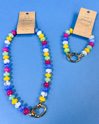 Two colorful beaded stretch bracelets with gold-tone clasp ring
