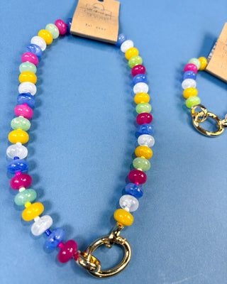 A colorful beaded necklace with a gold clasp