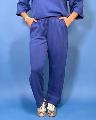 a matching royal blue lounge set consisting of a short-sleeve top with wide three-quarter sleeves and matching pants
