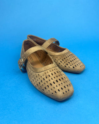 Brown Faux Suede Mary Jeane One Strap Mule held up against a solid blue background. 
