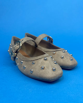 Gold Studded Brown One Strap Mary Jane Flats against a solid blue background. 
