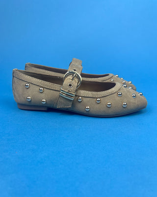 Gold Studded Brown One Strap Mary Jane Flats against a solid blue background. 