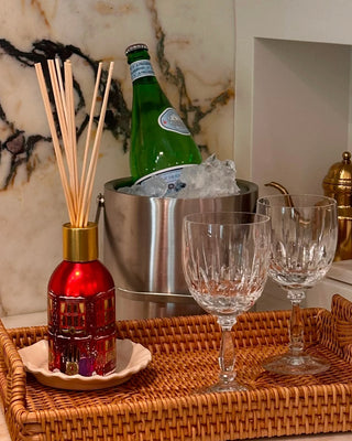 Holiday reed diffuser with Dancing Sugar Plums scent by Glasshouse Fragrances in collectible Christmas packaging