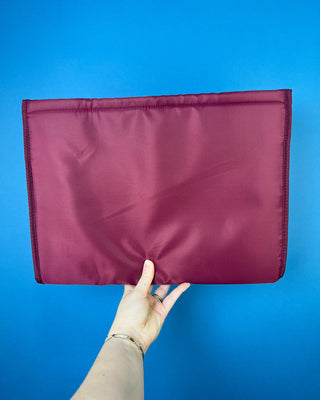 Case Mate Tote Bag Organizer Inserts in Colors Mulberry, Ballet Pink, & French Vanilla displayed against a slid blue background. 