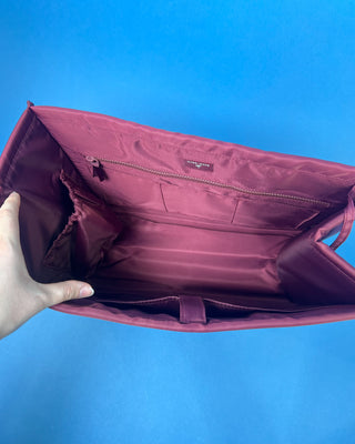 Case Mate Tote Bag Organizer Inserts in Colors Mulberry, Ballet Pink, & French Vanilla displayed against a slid blue background. 