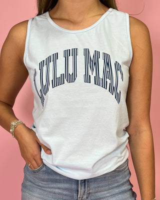 Person wearing a white tank top with 'VULUMAC' text on a pink background