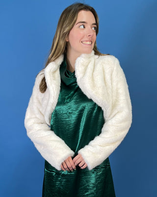 Ivory faux fur cropped jacket featuring a plush texture, open-front design, structured collar, and long sleeves.