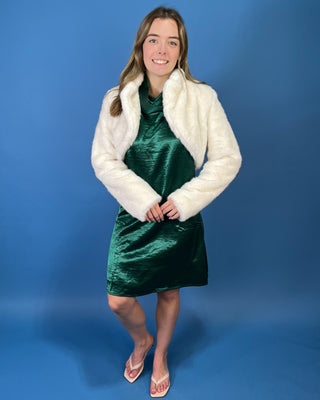 Ivory faux fur cropped jacket featuring a plush texture, open-front design, structured collar, and long sleeves.
