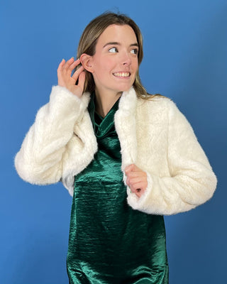 Ivory faux fur cropped jacket featuring a plush texture, open-front design, structured collar, and long sleeves.