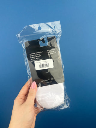 Lulu Mac Half-Crew Seamless Toe Single Pair Socks. In colors Hot Pink, Light blue, Orange, Grey, and Tan. Displayed against a solid blue background. 