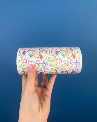 Mahjong Themed Slim Can Cooler Displayed Against a Solid Blue Background. 