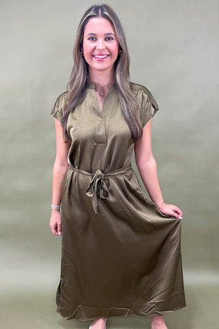 Olive satin midi dress with tie waist, cap sleeves, and v-neckline—an elegant and versatile look for day to night