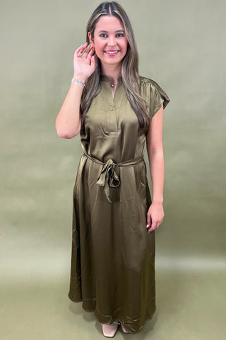 Olive satin midi dress with tie waist, cap sleeves, and v-neckline—an elegant and versatile look for day to night