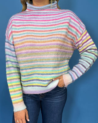Pastel multicolor striped knit sweater with a cozy mock neckline, long sleeves and relaxed fit.