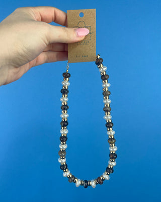 Shop the Coco Beaded Necklace in Brown & Gray featuring marbled beads, faux pearls, gold accents, and an adjustable chain. More Colors available.