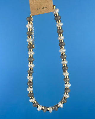Shop the Coco Beaded Necklace in Brown & Gray featuring marbled beads, faux pearls, gold accents, and an adjustable chain. More Colors available.