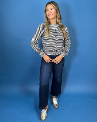 Navy and ivory striped cardigan top with light blue contrast trim, button front, long sleeves, and a relaxed fit.