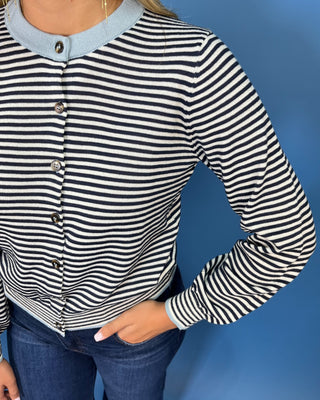 Navy and ivory striped cardigan top with light blue contrast trim, button front, long sleeves, and a relaxed fit.