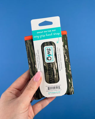 Shop the Swig Woodland Camo Coolies for cans and slim cans. Insulated, reusable sleeves with card pocket, hand strap, and rugged camo style.