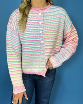 Pastel multicolor striped knit cardigan with white buttons, round neckline, long sleeves, and relaxed fit.
