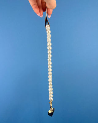 Shop the Heart Charm Pearl Necklace featuring classic faux pearls, a gold heart charm, and a stylish toggle clasp for timeless elegance.
