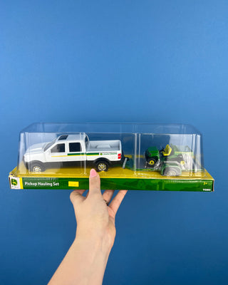 Shop the John Deere Pickup Hauling Set featuring a pickup truck, trailer, and riding mower. Officially licensed by John Deere for ages 3+.
