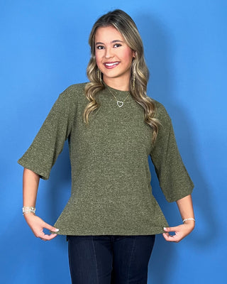 Olive green textured knit top with a round neckline, elbow-length sleeves, and relaxed fit.