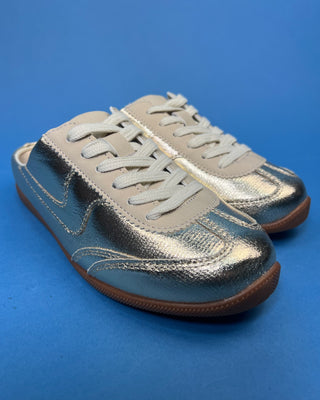 Shop the Stella Metallic Gold Slip On Sneaker featuring a metallic faux leather finish, cushioned comfort, and an easy slip-on design for everyday style.
