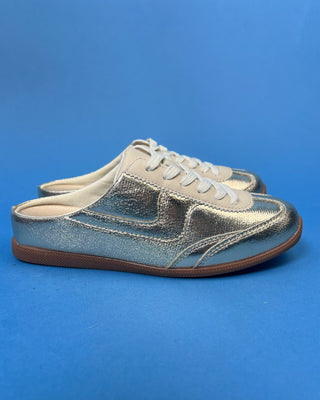 Shop the Stella Metallic Gold Slip On Sneaker featuring a metallic faux leather finish, cushioned comfort, and an easy slip-on design for everyday style.