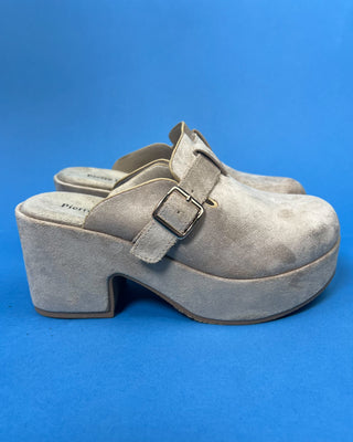 Shop the Nude Suede Closed Toe Platform Heel featuring soft faux suede, a platform sole, adjustable buckle, and a comfortable block heel for effortless everyday style.