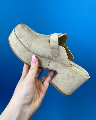 Shop the Nude Suede Closed Toe Platform Heel featuring soft faux suede, a platform sole, adjustable buckle, and a comfortable block heel for effortless everyday style.