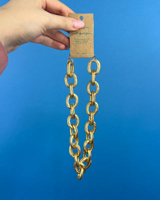 Shop the Keri Gold Link Necklace featuring bold textured oval links, an adjustable extender chain, and a timeless gold statement design.