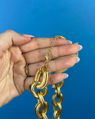 Shop the Keri Gold Link Necklace featuring bold textured oval links, an adjustable extender chain, and a timeless gold statement design.